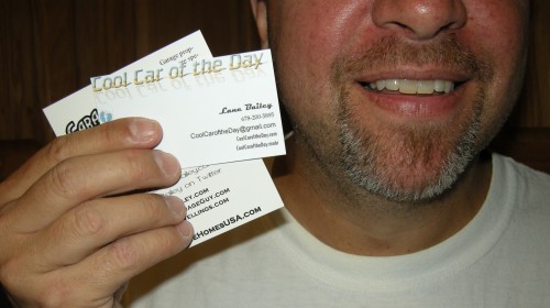 smile, business cards and a hand to shake smile, business cards and a hand to shake